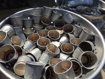 High angle view of old tin containers