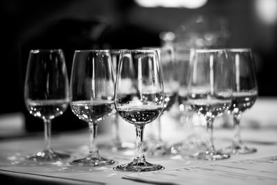 Close-up of wine glasses on table