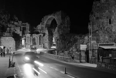 Buildings in city at night