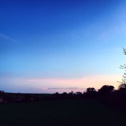 Scenic view of landscape against sky at sunset