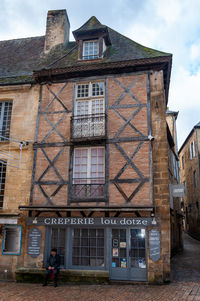 Low angle view of old building against sky