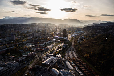 High angle view of buildings in city against sky during sunset