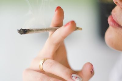 Close-up of woman smoking weed