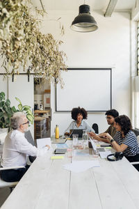 Multiracial colleagues planning and working together at office