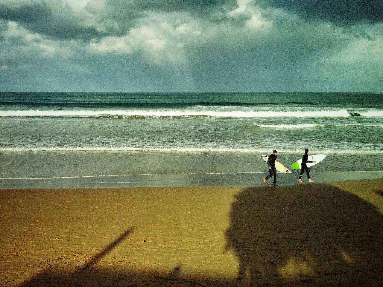 sea, horizon over water, beach, sky, water, cloud - sky, shore, lifestyles, sand, leisure activity, cloudy, cloud, men, scenics, beauty in nature, tranquil scene, person, vacations