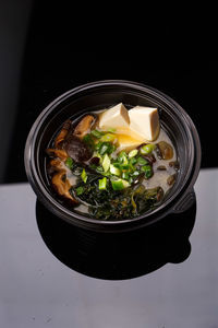 High angle view of food in bowl against black background