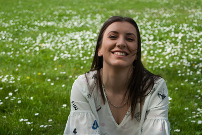 Portrait of a smiling young woman standing outdoors