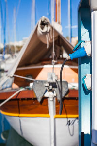 Close-up of sailboat moored in sea