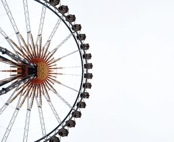 Low angle view of ferris wheel against sky