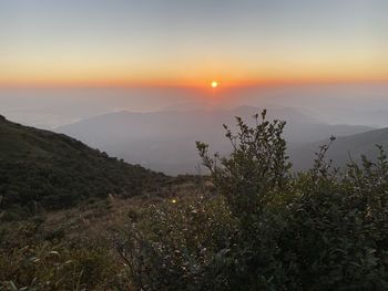 Scenic view of mountains against sky during sunset