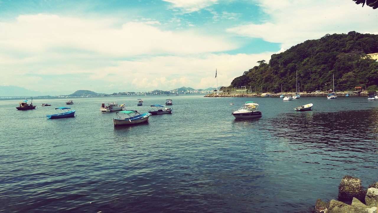 BOATS IN SEA AGAINST SKY