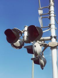 Low angle view of street light against sky