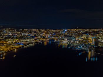 High angle view of illuminated buildings in city at night