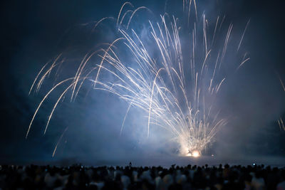 Firework display at night