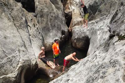 High angle view of men on rock