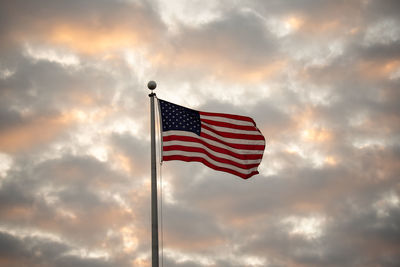 Low angle view of flag against sky