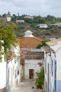 Houses in town against sky