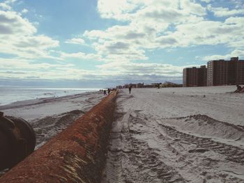 Scenic view of sea against cloudy sky