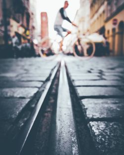 Surface level of man cycling on road