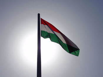 Low angle view of hungarian flag against sky