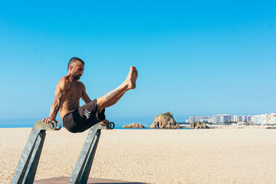 Sportsman practicing stretching and calisthenics