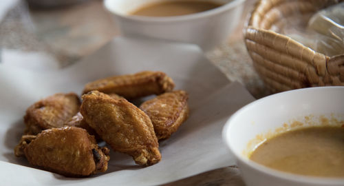 High angle view of chicken meat in plate on table