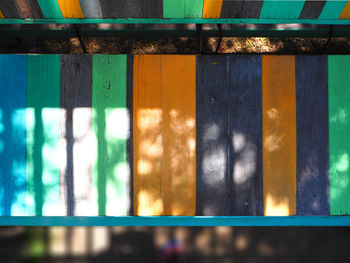 Sunlight falling on wooden bench