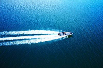 High angle view of people on boat sailing in sea