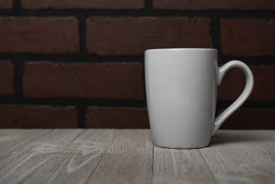 Close-up of coffee cup on table