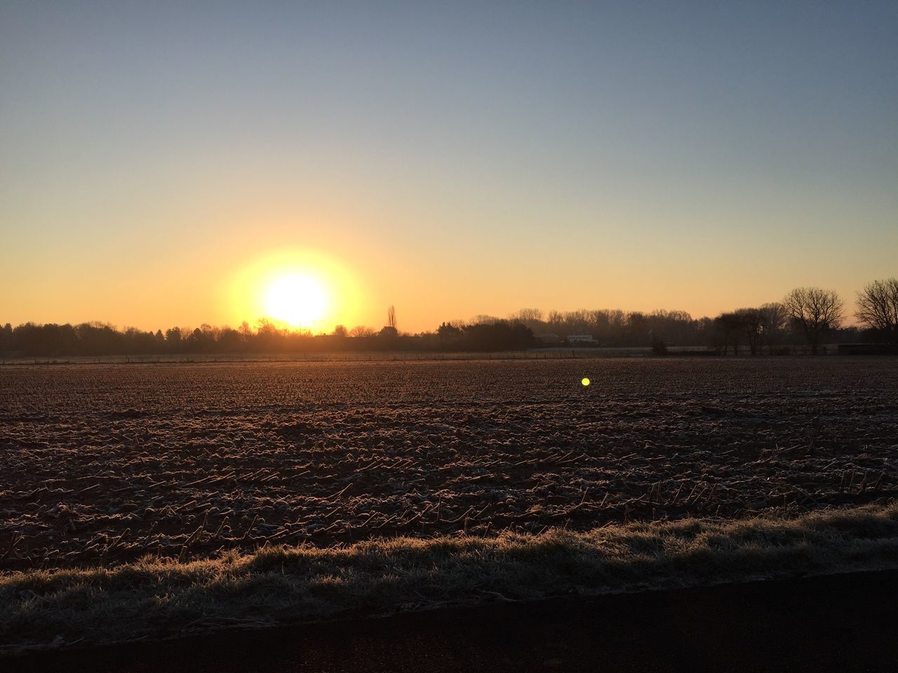 sunset, sun, tranquil scene, clear sky, scenics, copy space, landscape, tranquility, winter, orange color, beauty in nature, snow, cold temperature, nature, sunlight, field, idyllic, silhouette, sunbeam, sky