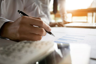 Close-up of man working on table