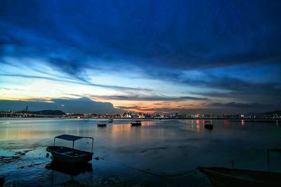 Boats in harbor at dusk