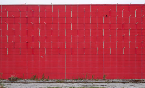 Hooks mounted on red brick wall