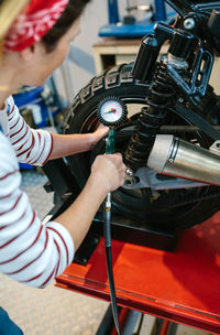 Cropped image of man repairing car