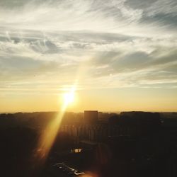 High angle view of city at sunset