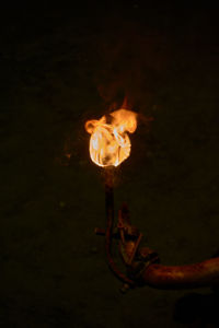 High angle view of bonfire against black background