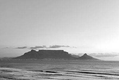 Scenic view of sea and table mountain, lion head and signal hill from table view  against sky 