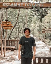 Portrait of young man standing outdoors