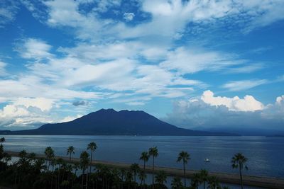 Scenic view of calm lake against cloudy sky