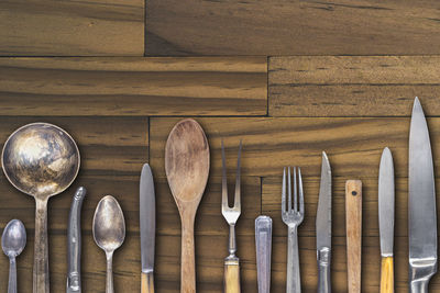 Close-up of kitchen utensils on wooden table