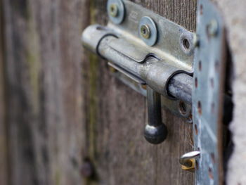 Close-up of old metal latch on door