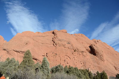 Low angle view of rock formations against sky