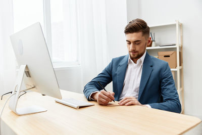 Businessman working at desk in office