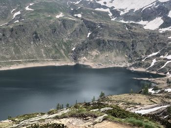 Scenic view of lake by snowcapped mountains