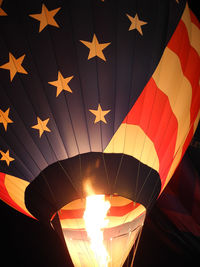 Low angle view of hot air balloon at night