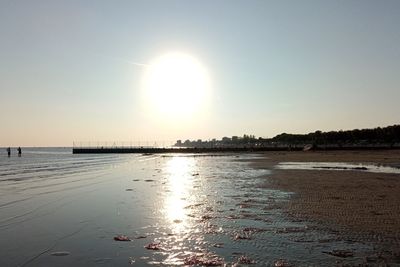 Scenic view of sea against clear sky during sunset