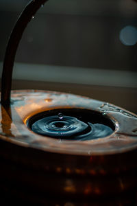 High angle view of water drop on mirror