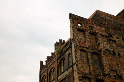 Low angle view of historic building against sky