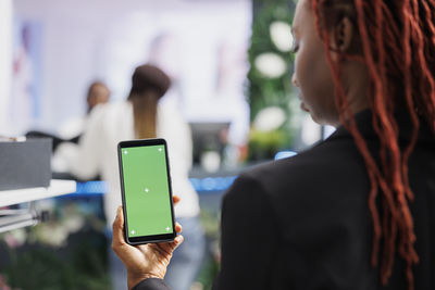 Young woman using mobile phone