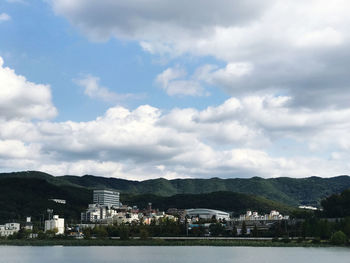 Buildings and houses against sky in city